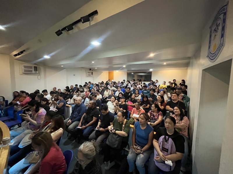Attendees fill the seats at NZ Immigration Help Service's April 2026 free immigration seminar in the Philippines, a packed room facing the presenter.
