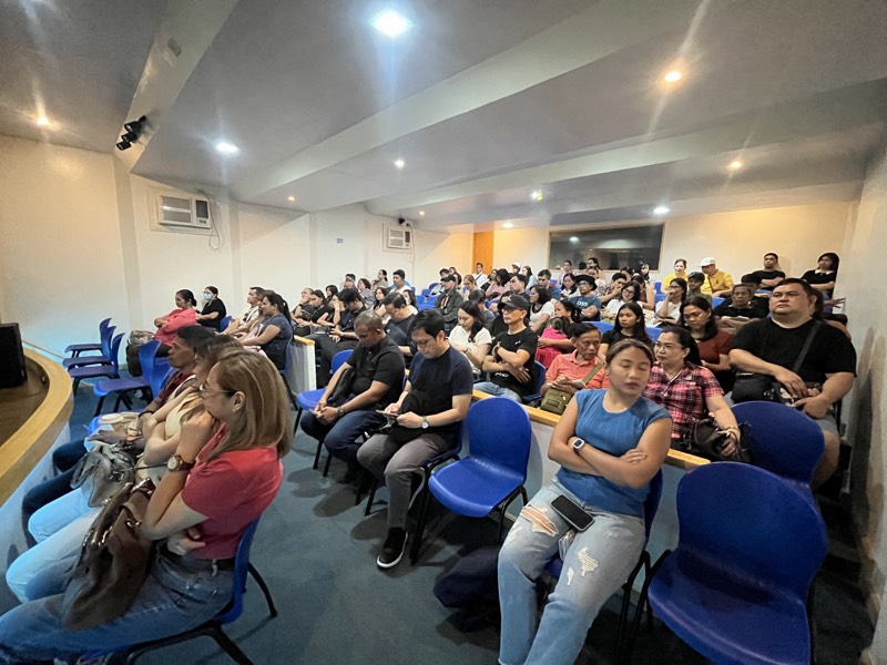 Attendees fill rows of blue chairs at the NZIHS April 2026 free immigration seminar in the Philippines.